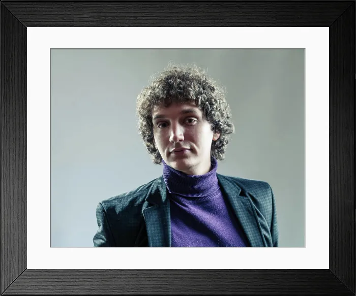 Framed Print : Detailed portrait of a young caucasian guy with curly hair Head Framed Print : Detailed portrait of a young caucasian guy with curly hair Head