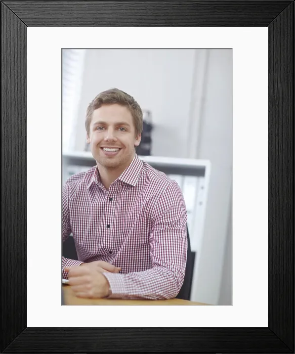 Framed Print : Man, portrait and happy in office on desk with proud for career growth as human resources manager