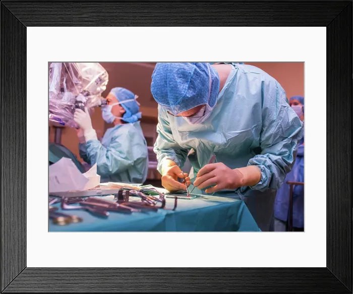 Framed Print : Surgeon performing cochlear implant surgery Framed Print : Surgeon performing cochlear implant surgery