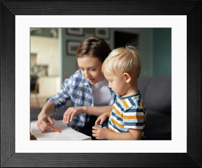 Framed Print : Mother spending time with little son and painting at home Framed Print : Mother spending time with little son and painting at home