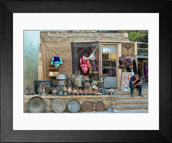 Framed Print : Selling pottery in the Old City of Baku, Flaming Tower in the distance, Azerbaijan