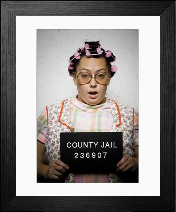 Framed Print : Mug shot of woman in curlers