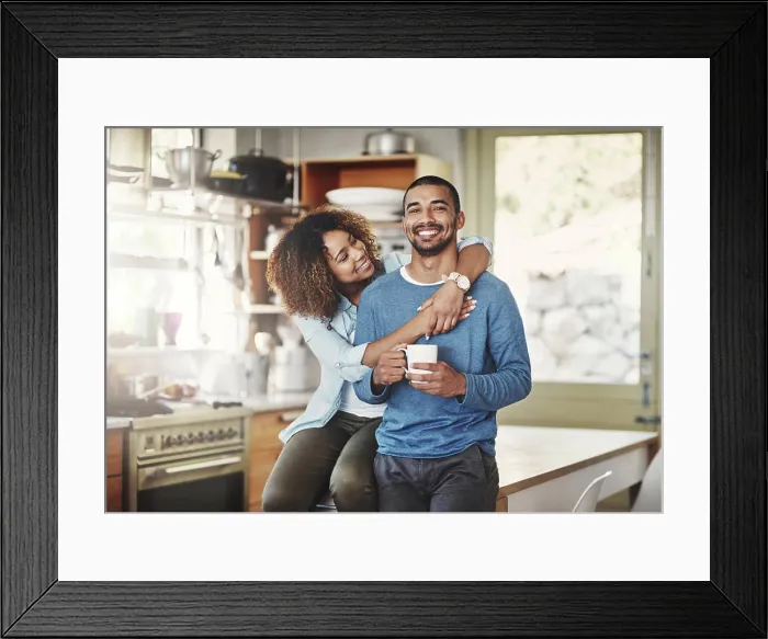 Framed Print : Happy, hugging and smiling young in love couple bonding in a kitchen at home Framed Print : Happy, hugging and smiling young in love couple bonding in a kitchen at home