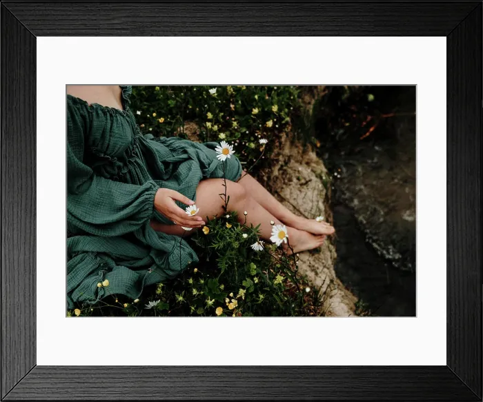 Framed Print : Woman in green dress sitting in wildflower meadow Framed Print : Woman in green dress sitting in wildflower meadow