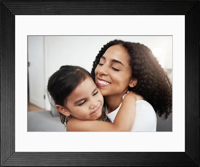 Framed Print : Hug, love and girl with mother on a sofa Framed Print : Hug, love and girl with mother on a sofa