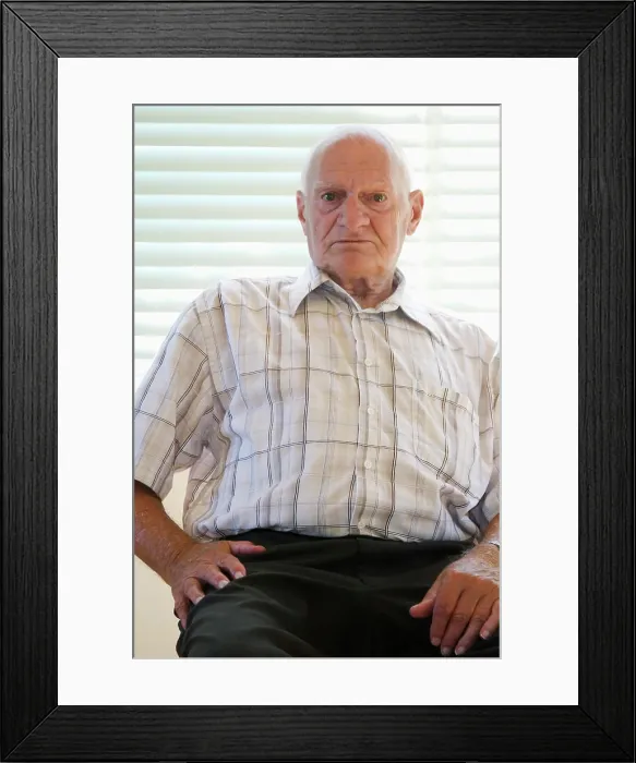 Framed Print : senior citizen 70-80 years old sitting on chair in vacant house, Canada Framed Print : senior citizen 70-80 years old sitting on chair in vacant house, Canada