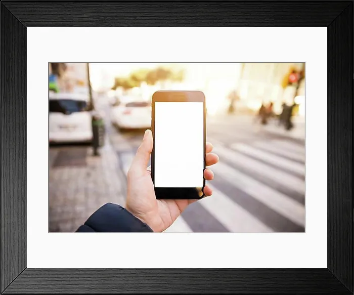 Framed Print : Close up mans hand showing mobile phone with white screen display road Framed Print : Close up mans hand showing mobile phone with white screen display road