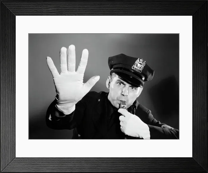 Framed Print : 1950s 1960s POLICE MAN LOOKING AT CAMERA HAT WITH BADGE BLOWING WHISTLE WHITE GLOVED HAND UP TO HALT STOP TRAFFIC Framed Print : 1950s 1960s POLICE MAN LOOKING AT CAMERA HAT WITH BADGE BLOWING WHISTLE WHITE GLOVED HAND UP TO HALT STOP TRAFFIC