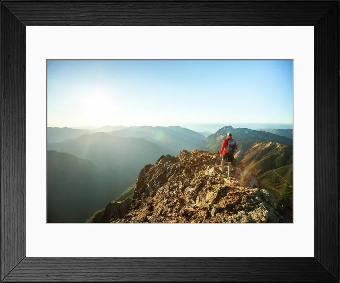 Framed Print : Side view of backpacker approaching mountain summit at sunset Framed Print : Side view of backpacker approaching mountain summit at sunset