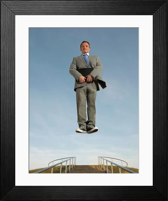 Framed Print : Businessman hovering above the ground