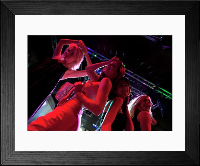 Framed Print : A group of female friends dancing on a nightclub dance floor