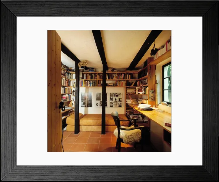 Framed Print : Chair at pine desk in study bedroom with wall shelves above bed with leather cover