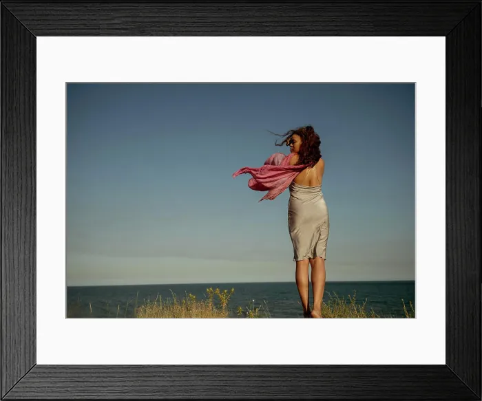 Framed Print : African American Woman with Fabric on Seashore, Back View