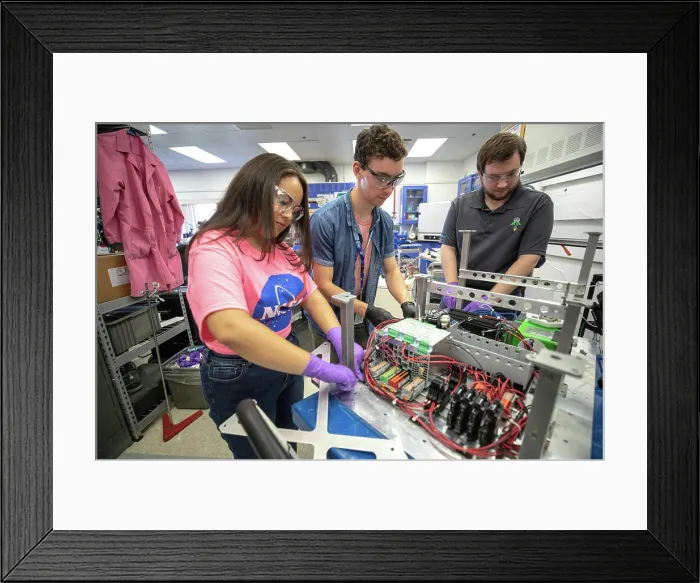 Framed Print : From left, Kennedy Space Center interns Brianna Sandoval and Patrick Follis