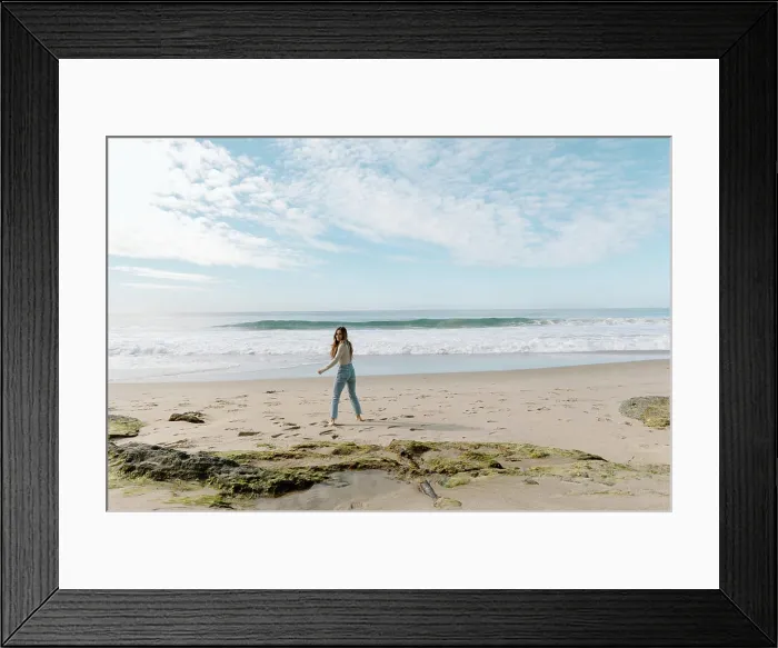 Framed Print : Young woman walking on California beach