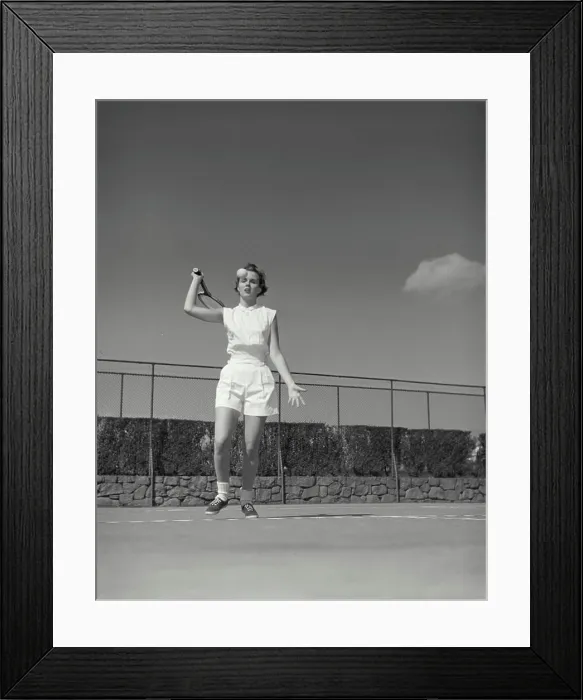Framed Print : Vintage Photograph. Woman gets ready to hit tennis ball on court she is in the serving position
