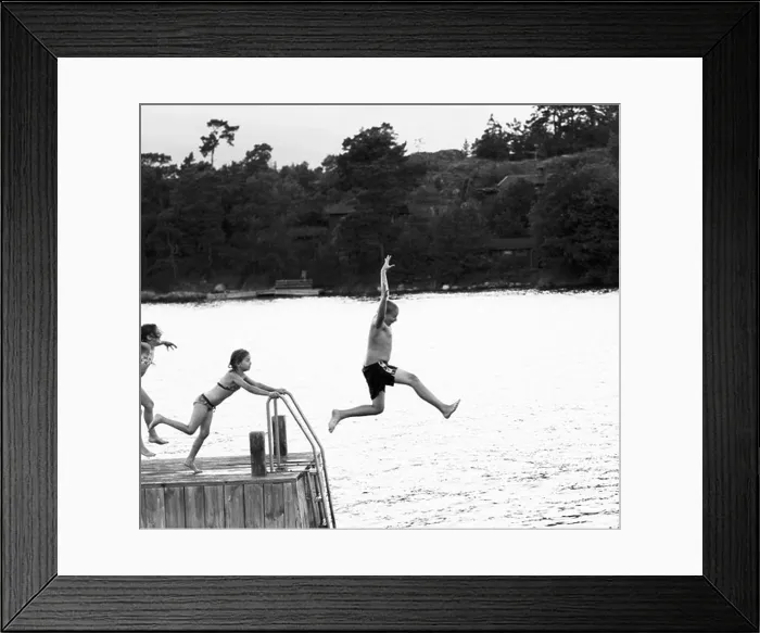 Framed Print : Three children jumping from a jetty, Sweden