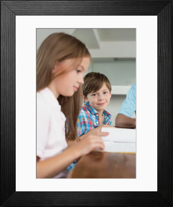 Framed Print : Children doing homework with their grandfather Framed Print : Children doing homework with their grandfather