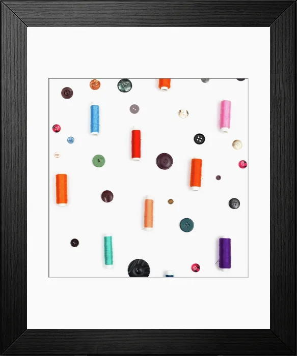 Framed Print : spools of sewing thread and different buttons spools of sewing thread Framed Print : spools of sewing thread and different buttons spools of sewing thread