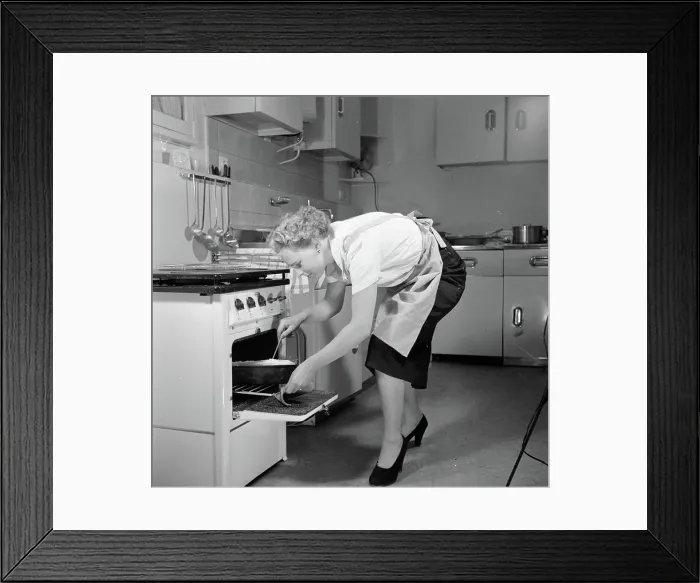 Framed Print : Poll photo collection. Advertising photography. Housewife in model kitchen busy making a cake.. June 1, 1953 Framed Print : Poll photo collection. Advertising photography. Housewife in model kitchen busy making a cake.. June 1, 1953