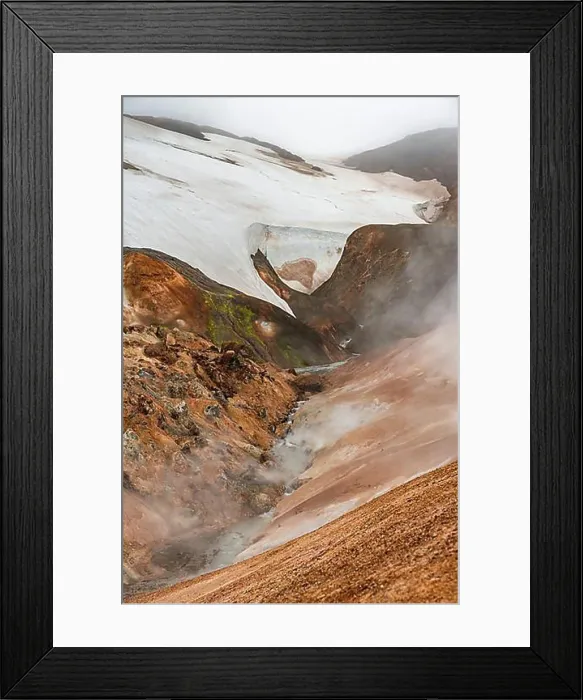 Framed Print : Steaming stream between colourful rhyolite mountains and snowfields