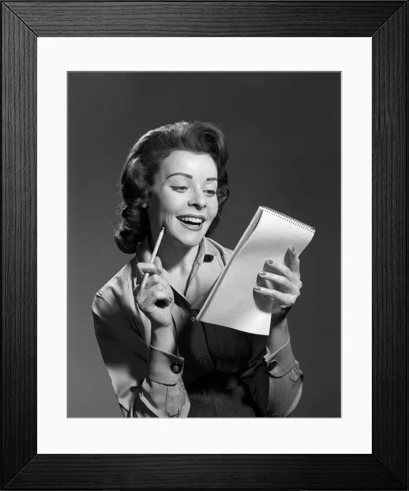 Framed Print : 1950S Smiling Young Woman Holding Pencil And Steno Notepad Framed Print : 1950S Smiling Young Woman Holding Pencil And Steno Notepad