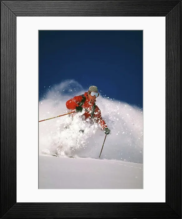 Framed Print : Downhill skier skiing on mountain Framed Print : Downhill skier skiing on mountain