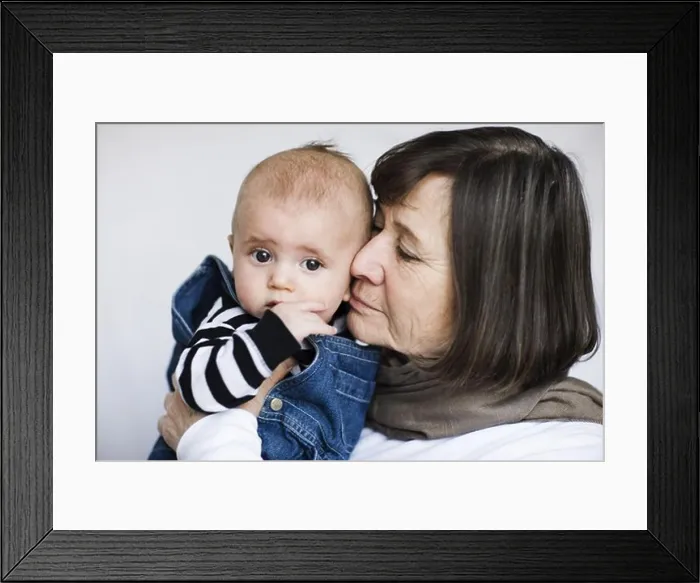 Framed Print : Grandmother holding grandson, close-up