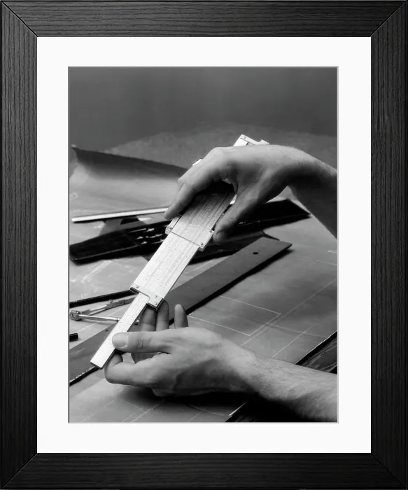 Framed Print : 1930S Man'S Hands Using Slide Rule Over Drafting Table Framed Print : 1930S Man'S Hands Using Slide Rule Over Drafting Table