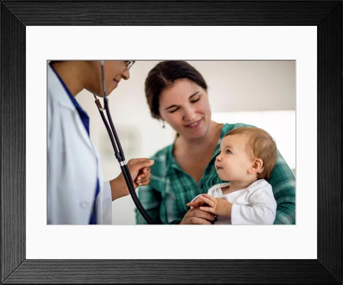 Framed Print : Baby boy getting a medical check up Framed Print : Baby boy getting a medical check up