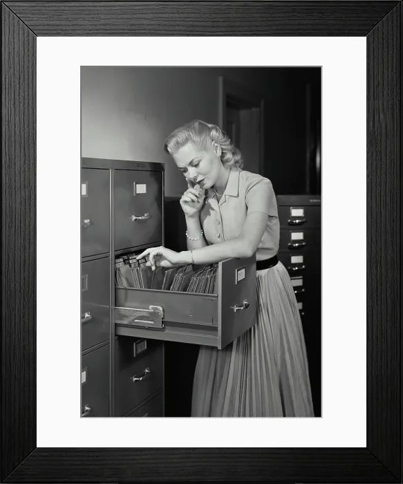 Framed Print : Vintage Photograph. Young woman wearing dress going through folders in drawer of filing cabinet, Frame 4 Framed Print : Vintage Photograph. Young woman wearing dress going through folders in drawer of filing cabinet, Frame 4