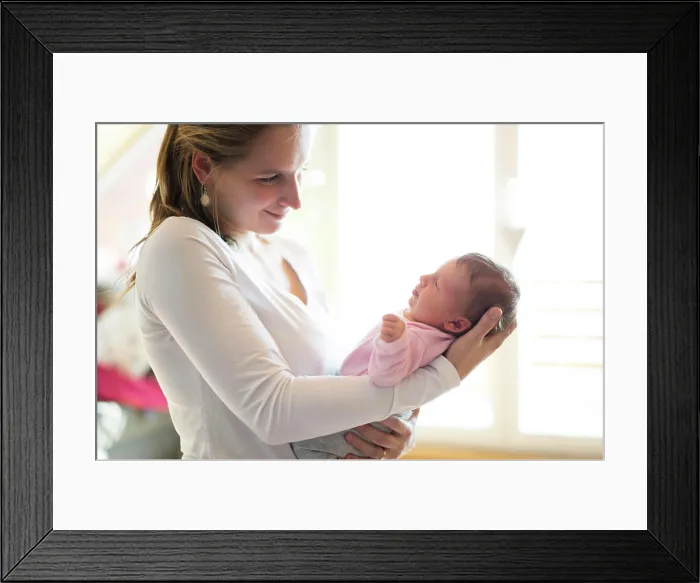 Framed Print : Mom holding newborn baby, looking at infant lovingly