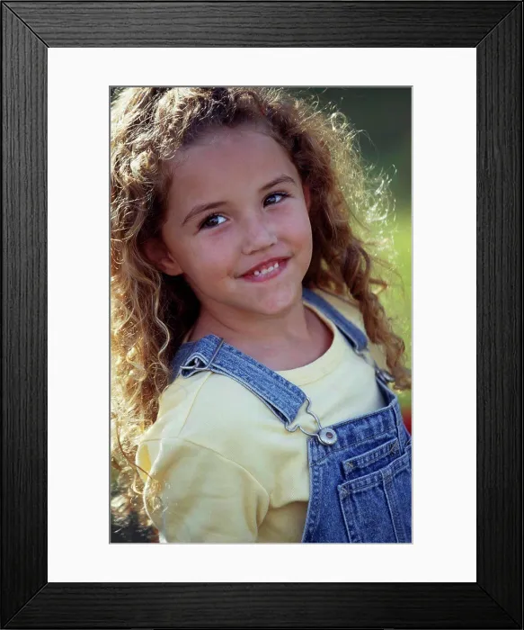Framed Print : Close-up of a girl smiling Framed Print : Close-up of a girl smiling