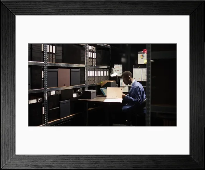 Framed Print : Expert male investigator at work Framed Print : Expert male investigator at work