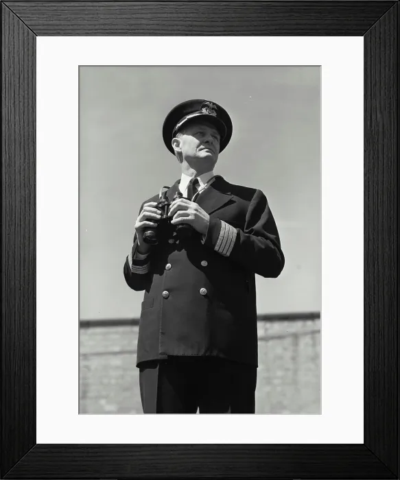 Framed Print : Vintage Photograph. Man in captains uniform standing with set of binoculars Framed Print : Vintage Photograph. Man in captains uniform standing with set of binoculars