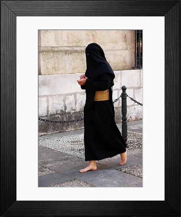 Framed Print : Penitent dressed in black penitential robe (nazareno) on their way to the Semana Santa Framed Print : Penitent dressed in black penitential robe (nazareno) on their way to the Semana Santa