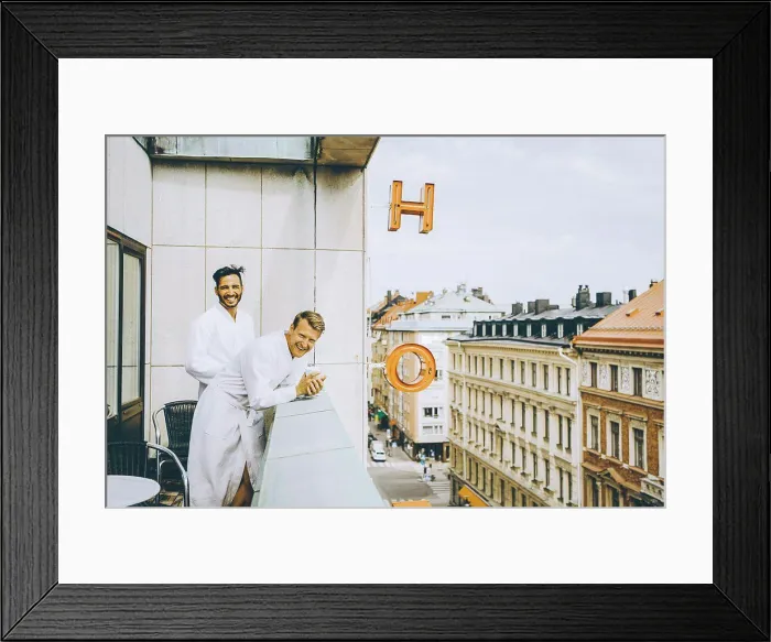 Framed Print : Smiling gay couple enjoying in hotel balcony Framed Print : Smiling gay couple enjoying in hotel balcony