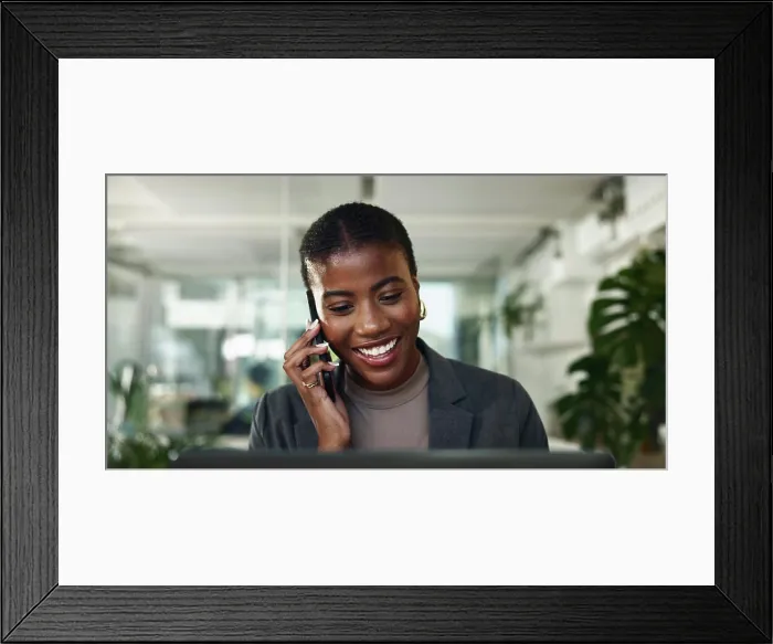 Framed Print : Black woman, phone call and plan on laptop in office Framed Print : Black woman, phone call and plan on laptop in office