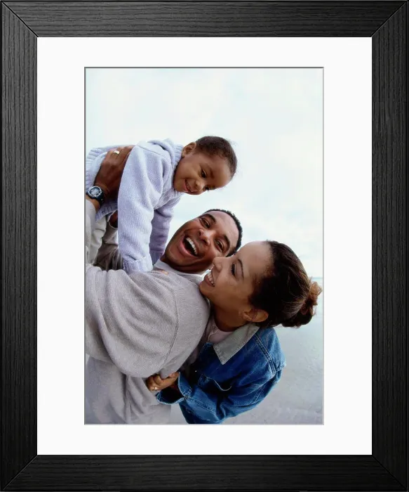 Framed Print : Father and mother together with their daughter at the beach Framed Print : Father and mother together with their daughter at the beach