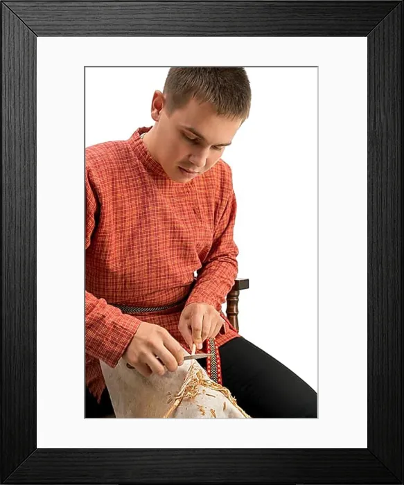 Framed Print : Wickerwork. Boy barks a twig, isolated on white background Framed Print : Wickerwork. Boy barks a twig, isolated on white background
