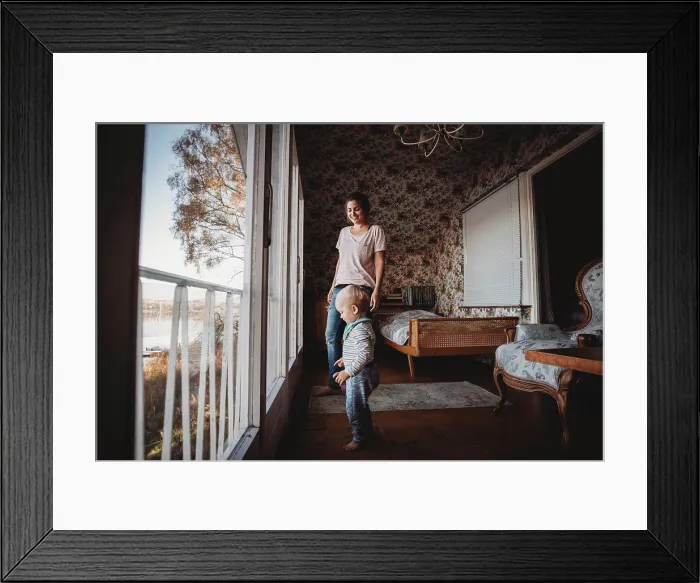 Framed Print : Mother and child in vintage bedroom with flower wallpaper Framed Print : Mother and child in vintage bedroom with flower wallpaper