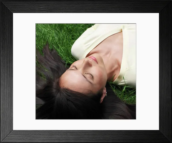 Framed Print : Woman Lying on Grass Framed Print : Woman Lying on Grass