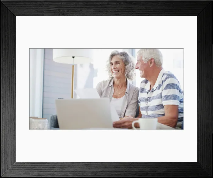 Framed Print : Happy, old couple and laptop on sofa for paperwork Framed Print : Happy, old couple and laptop on sofa for paperwork
