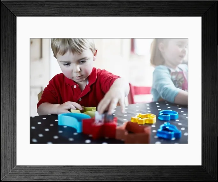 Framed Print : Children playing with shapes on table