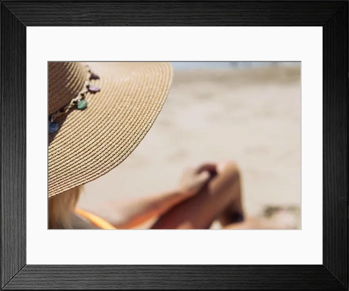 Framed Print : girl in a hat, a close-up on the tanned and slender legs of a girl, is a place for an inscription