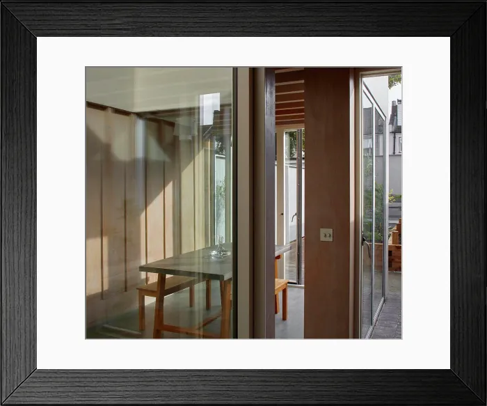 Framed Print : View through from interior courtyard to dining space interior Framed Print : View through from interior courtyard to dining space interior