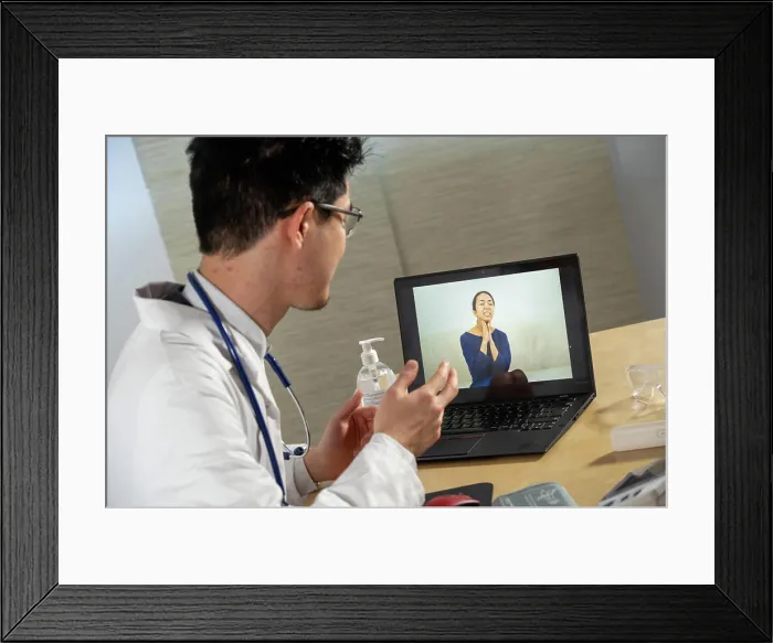 Framed Print : Doctor in remote consultation with 30 year old female patient with pain in her throat Framed Print : Doctor in remote consultation with 30 year old female patient with pain in her throat