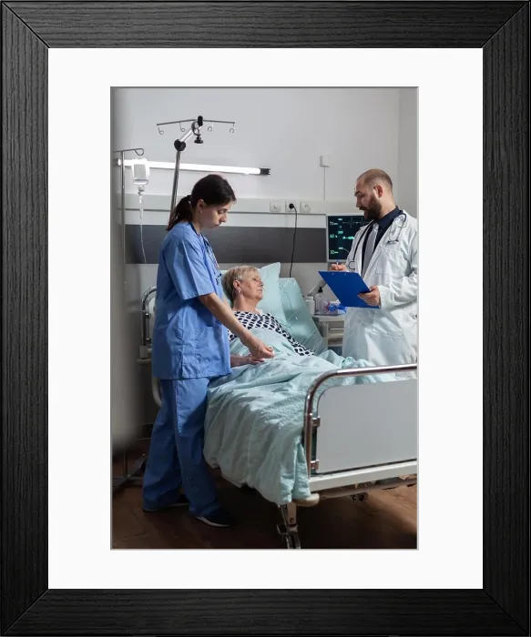 Framed Print : Sick senior woman getting medication through an intravenous line