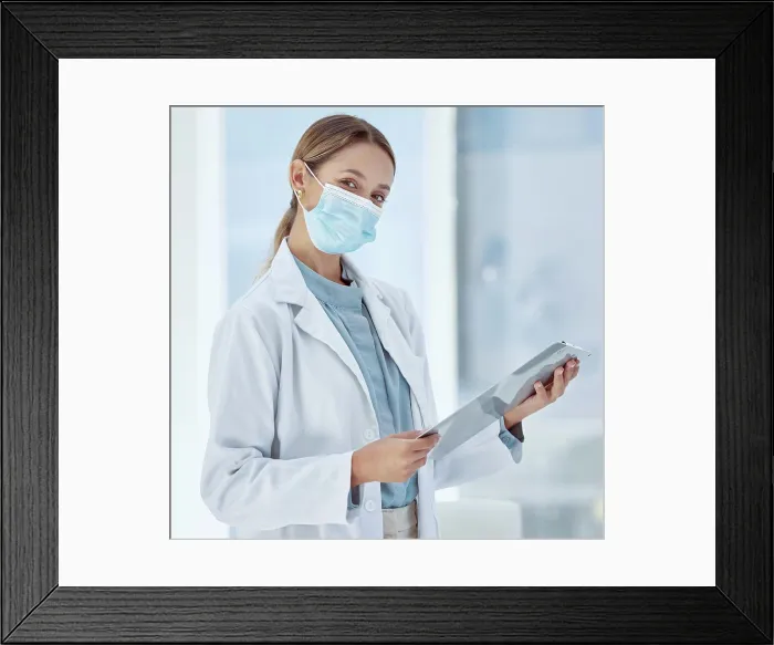 Framed Print : Doctor with covid face mask and a checklist for compliance Framed Print : Doctor with covid face mask and a checklist for compliance