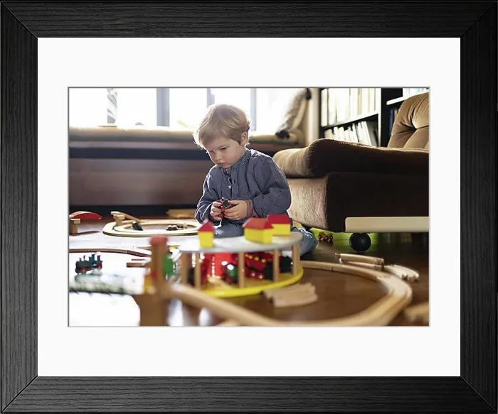 Framed Print : Toddler playing with a wooden railway, Bonn, Germany, Europe Framed Print : Toddler playing with a wooden railway, Bonn, Germany, Europe